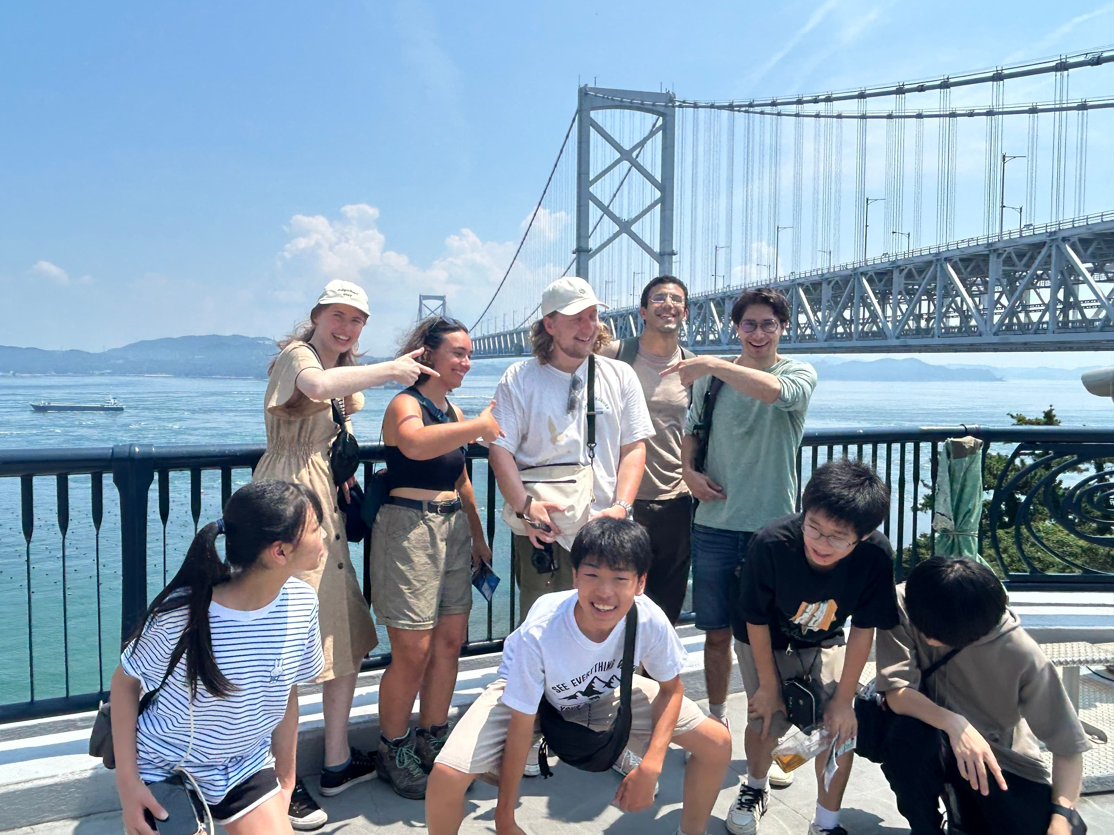 Group photo at the great suspension bridge over the sea